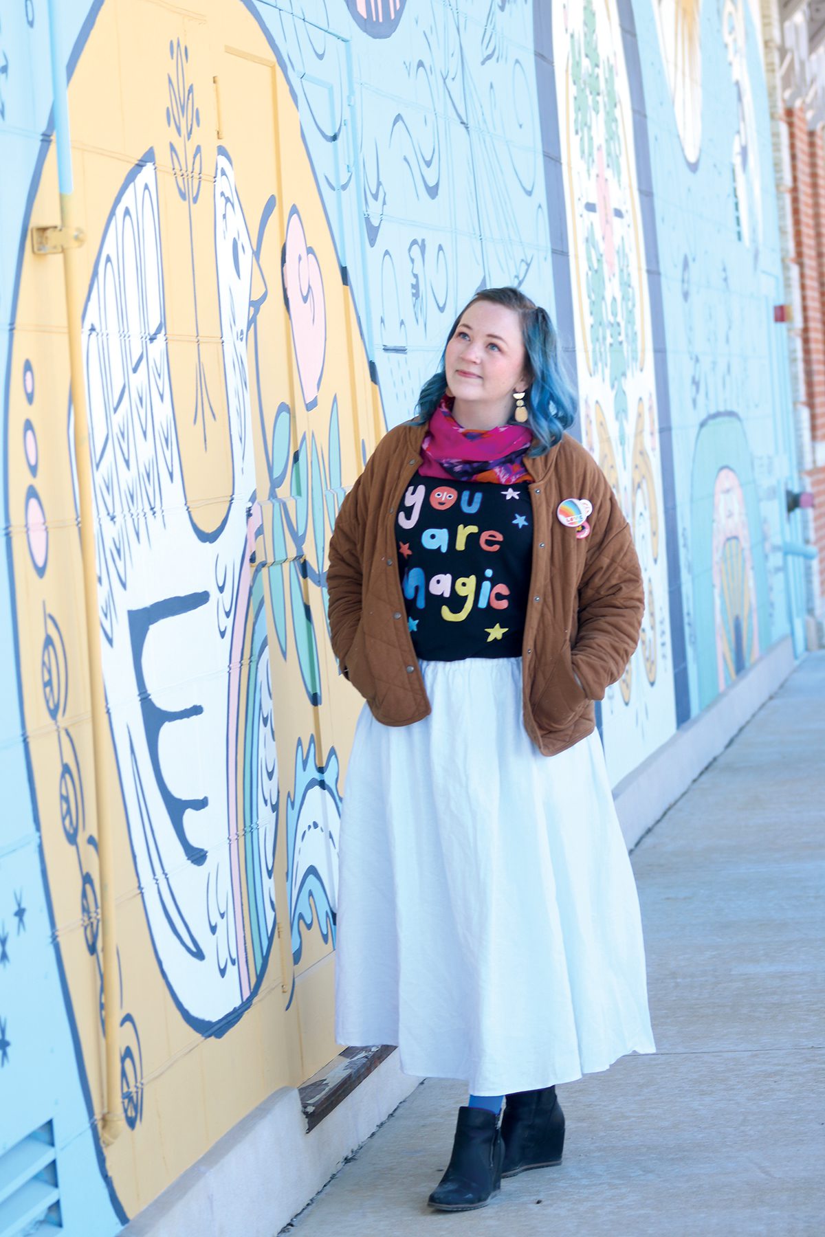 Lauren Bonney with her mural, Together in Decorah.
