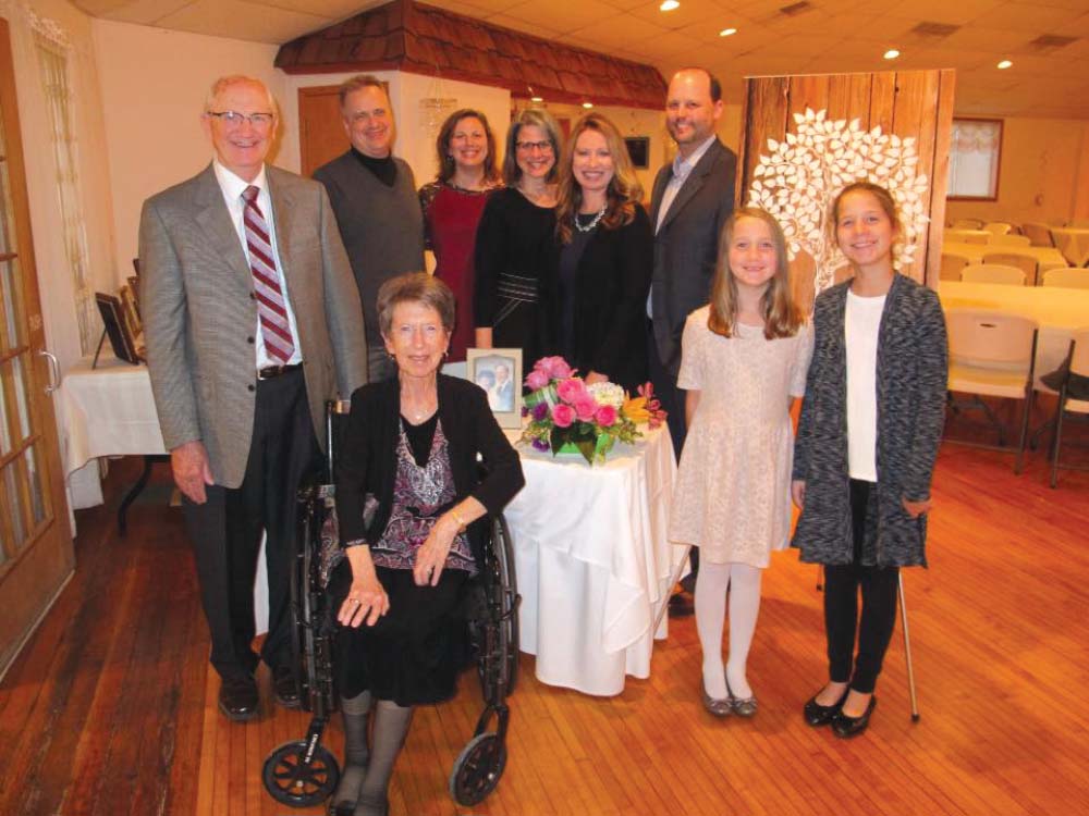 Alfred Ludeking in a group photo with his family surrounding him