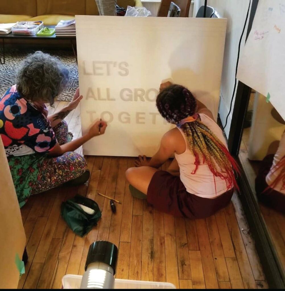 Sarah Johnson works on projects for mental health murals with Our Voices